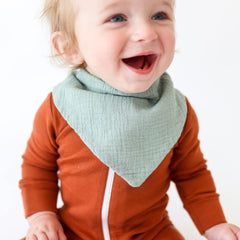 Konssy muslin baby bib in unisex colors suits boys and girls stylishly.