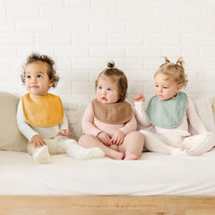 Konssy Muslin Baby Bibs 8-pack with adjustable nickel-free snaps for growing babies.