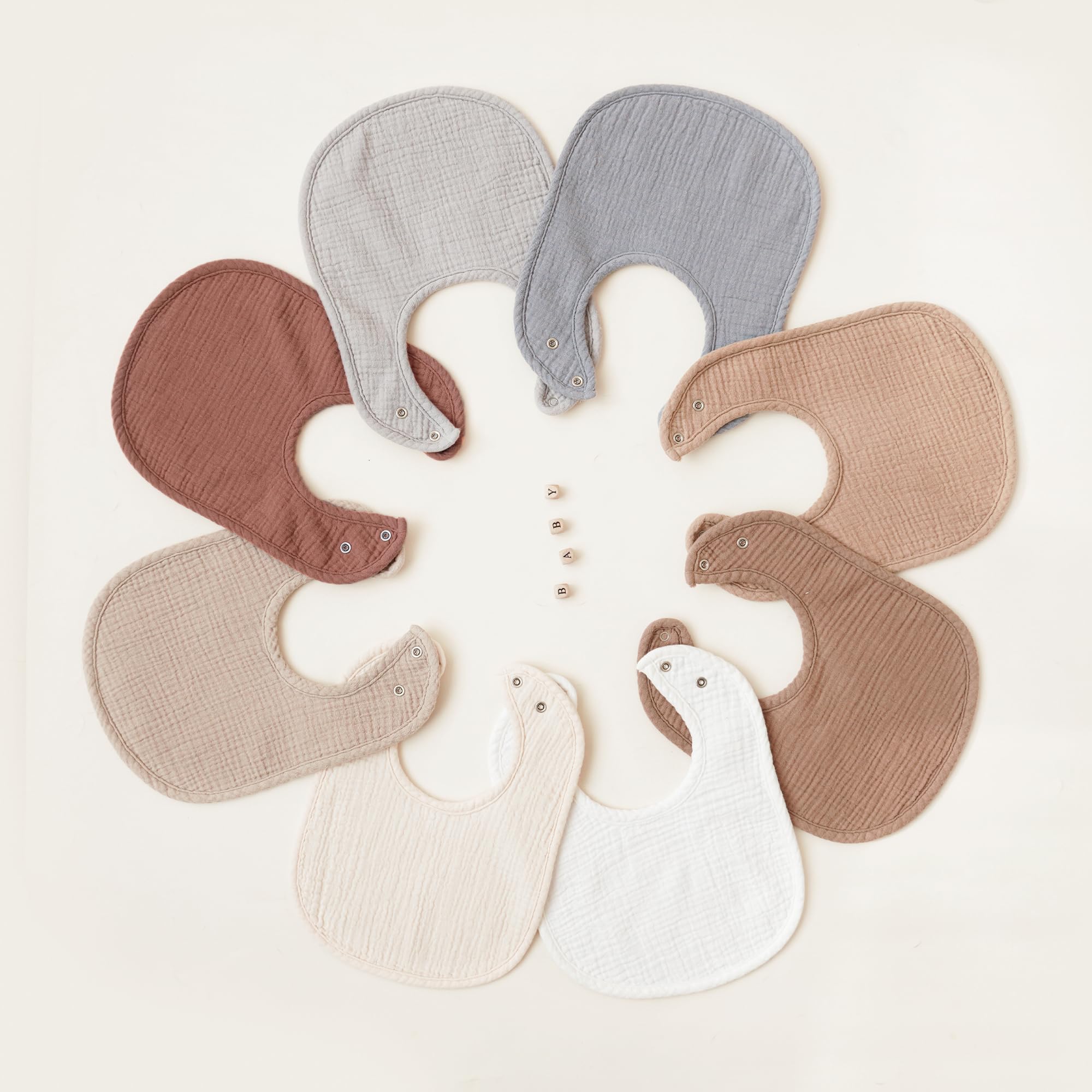 Konssy muslin baby bibs on baby wearing for teething drool management