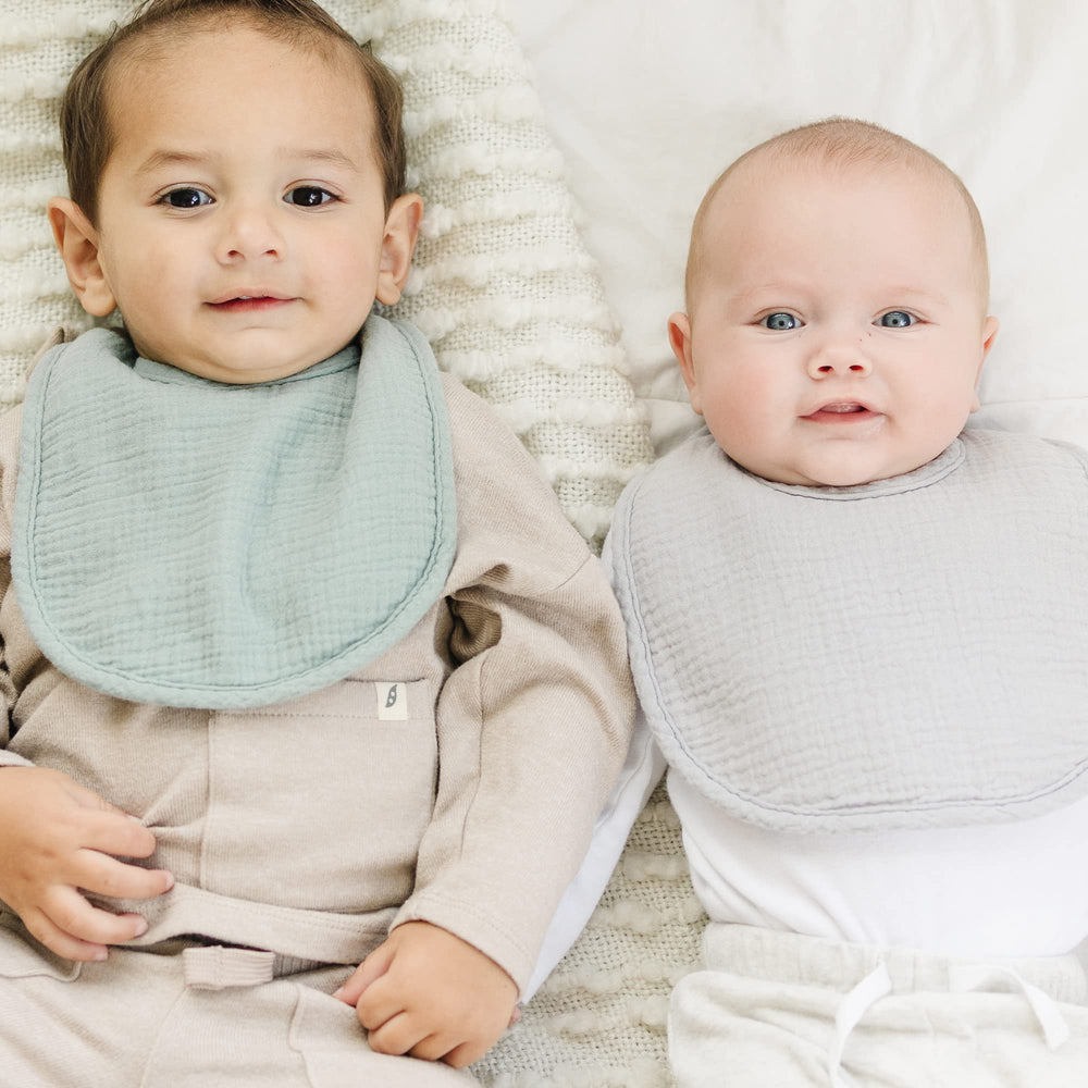Konssy muslin baby bibs teething-ready use during drool moments with soft fleece backing.