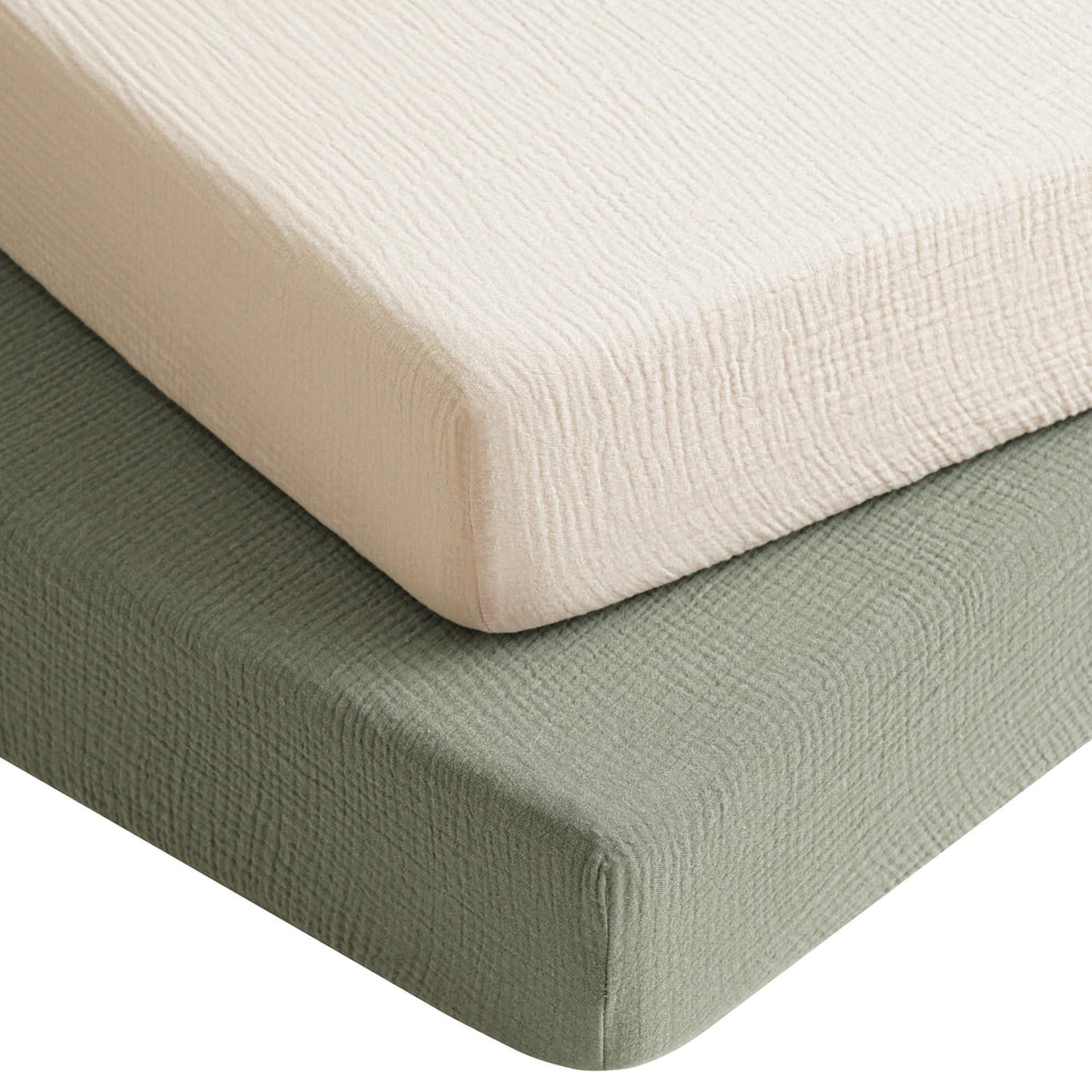 Konssy muslin crib sheets 2-pack in fog green cream set offer soft, breathable baby comfort.