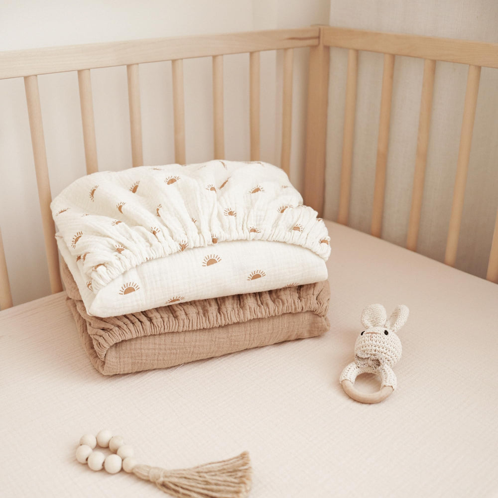 Konssy elastic-fit sheets stay snug on crib mattress for safe sleep.