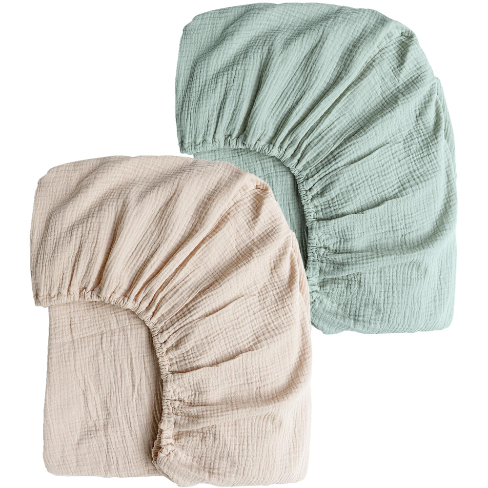 Konssy muslin crib sheets green-cream 2pcs set offers breathable comfort for baby.