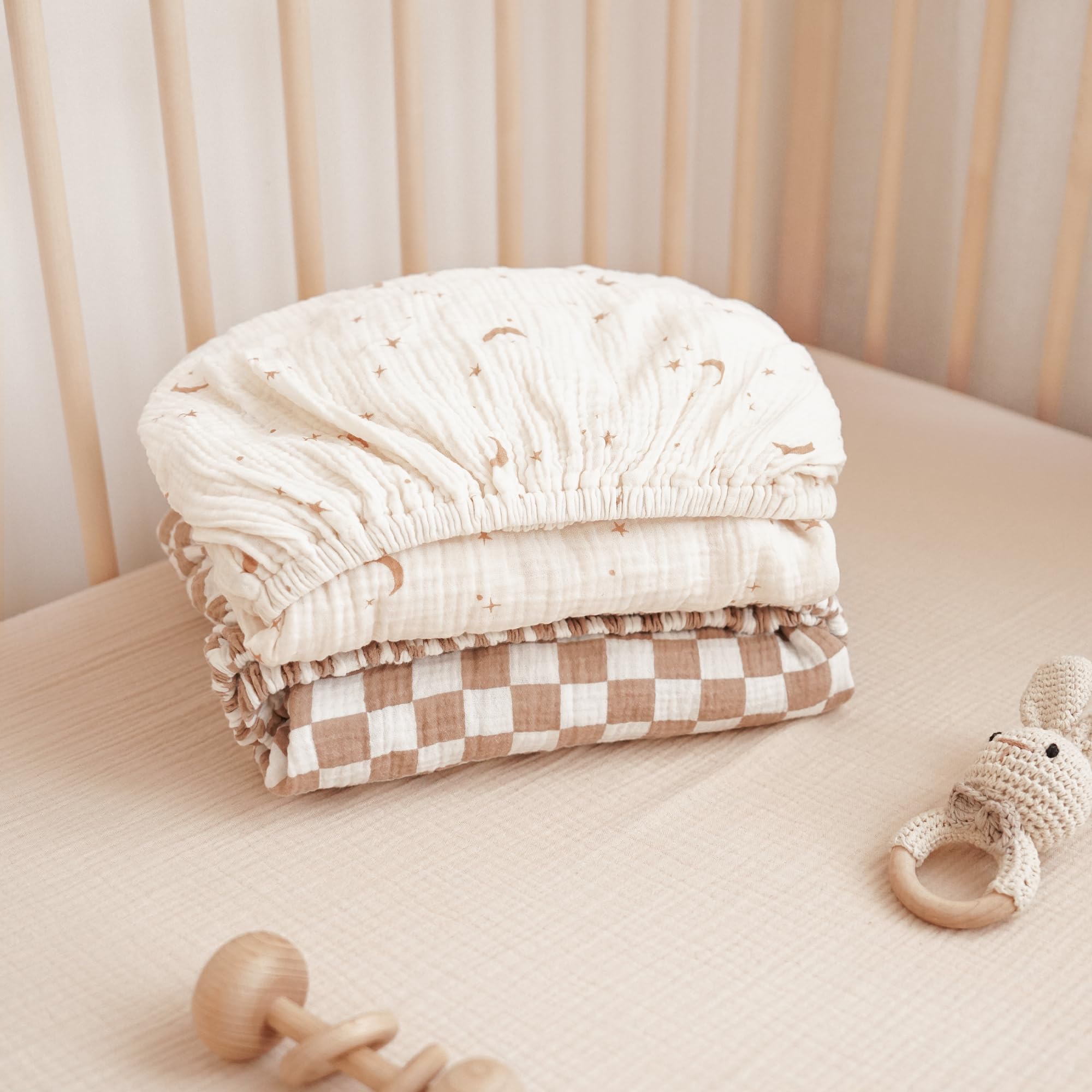 Konssy muslin crib sheets feature neutral prints for modern nurseries.