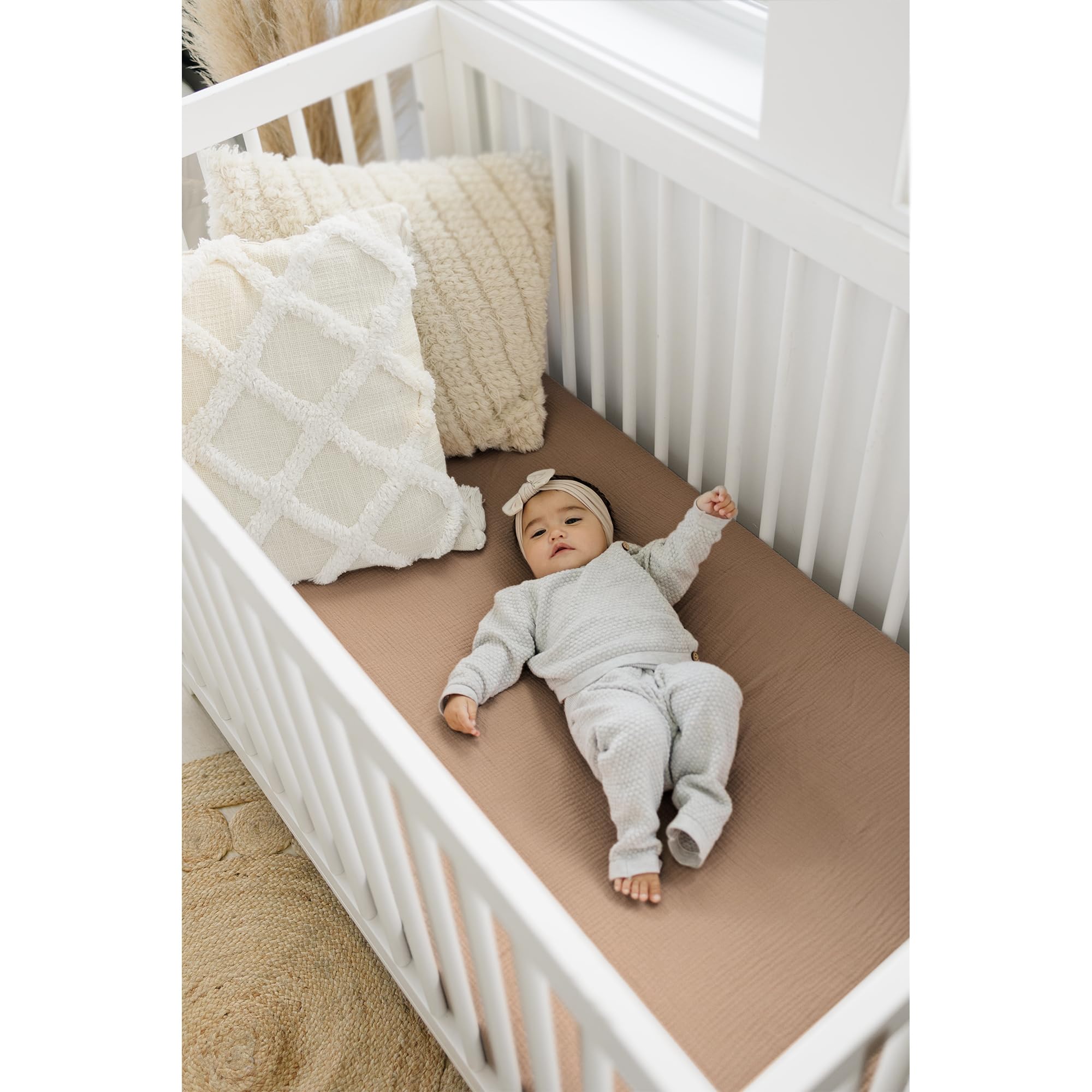 Konssy Muslin crib sheets on standard crib mattress showing secure, easy-care setup.