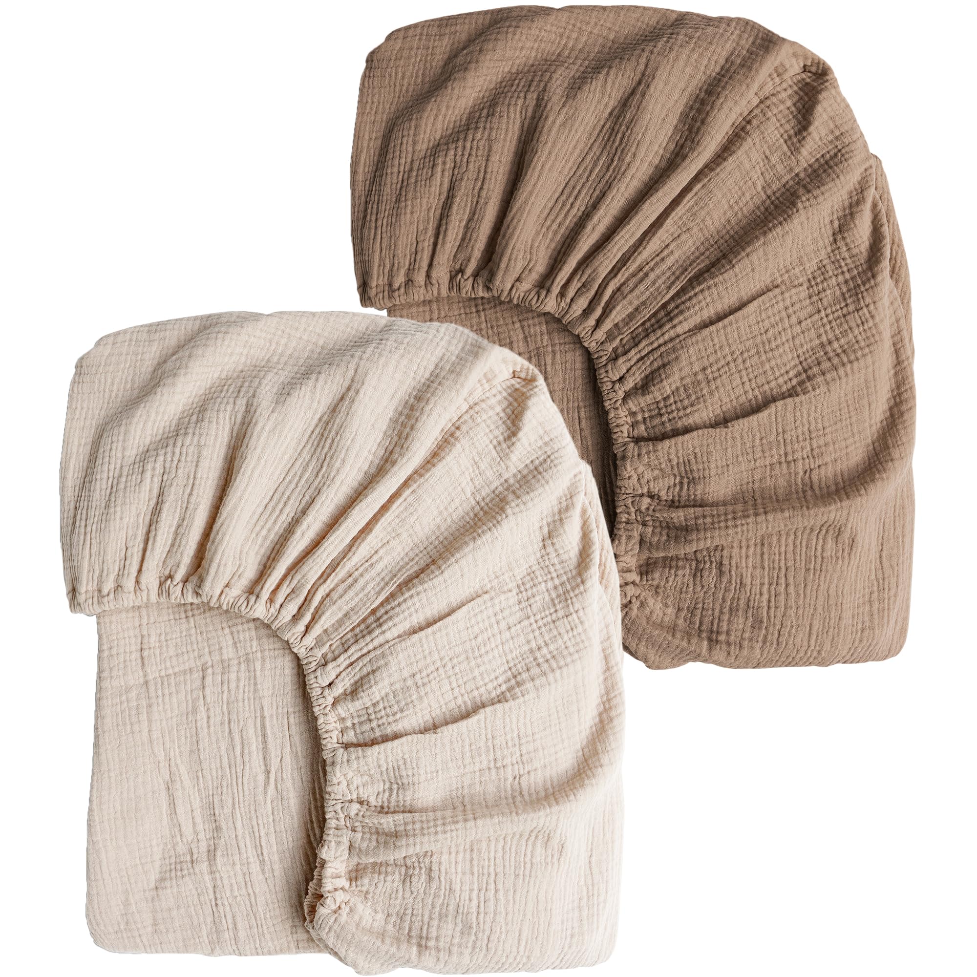 Konssy Muslin crib sheets two-pack on crib mattress delivering cozy breathable comfort.
