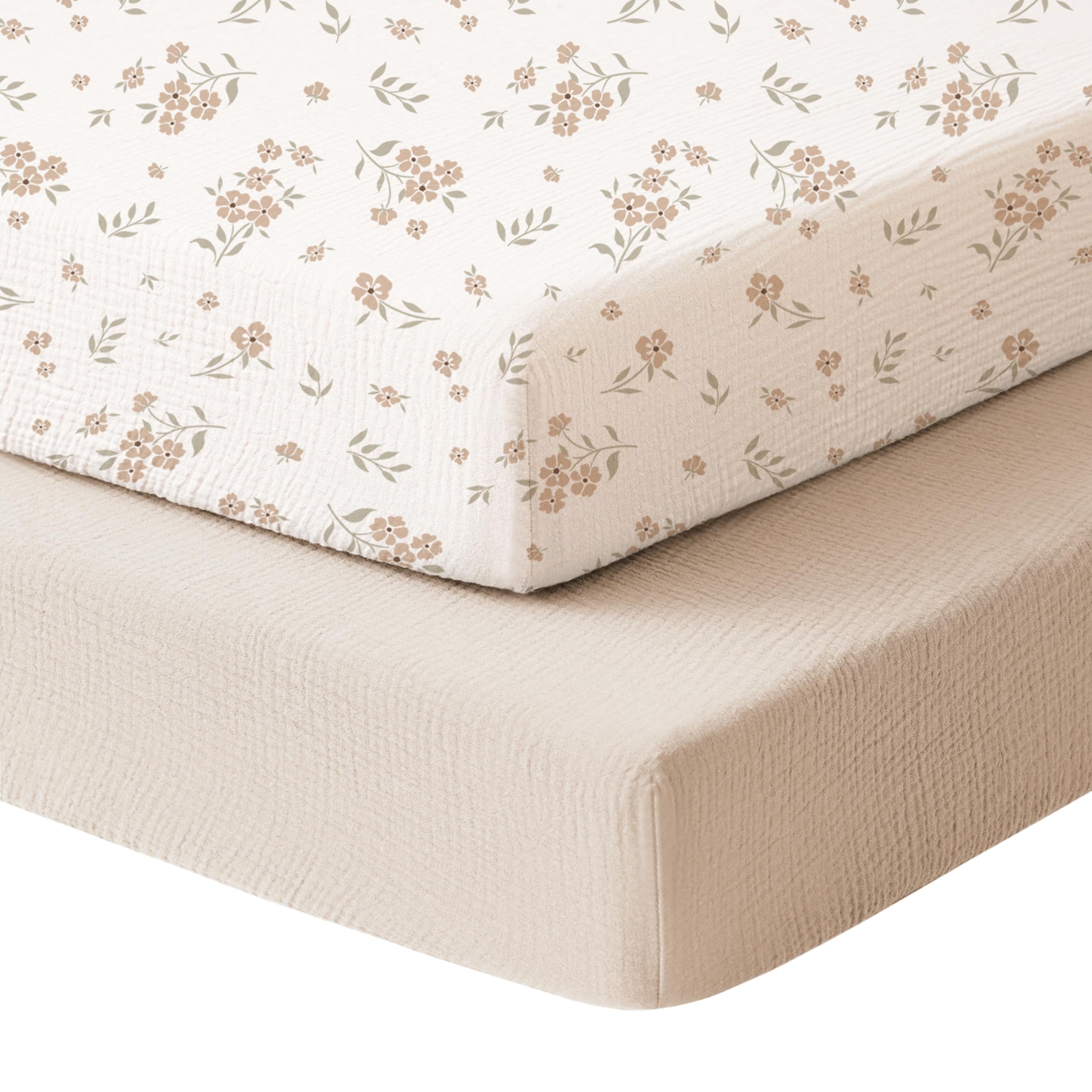 Konssy muslin mini crib sheets in cream blossom offer soft cotton for gentle naps.