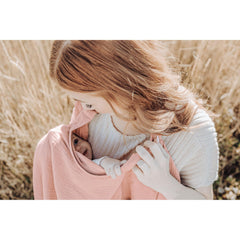 Konssy muslin nursing cover used as car-seat canopy for private space on the go