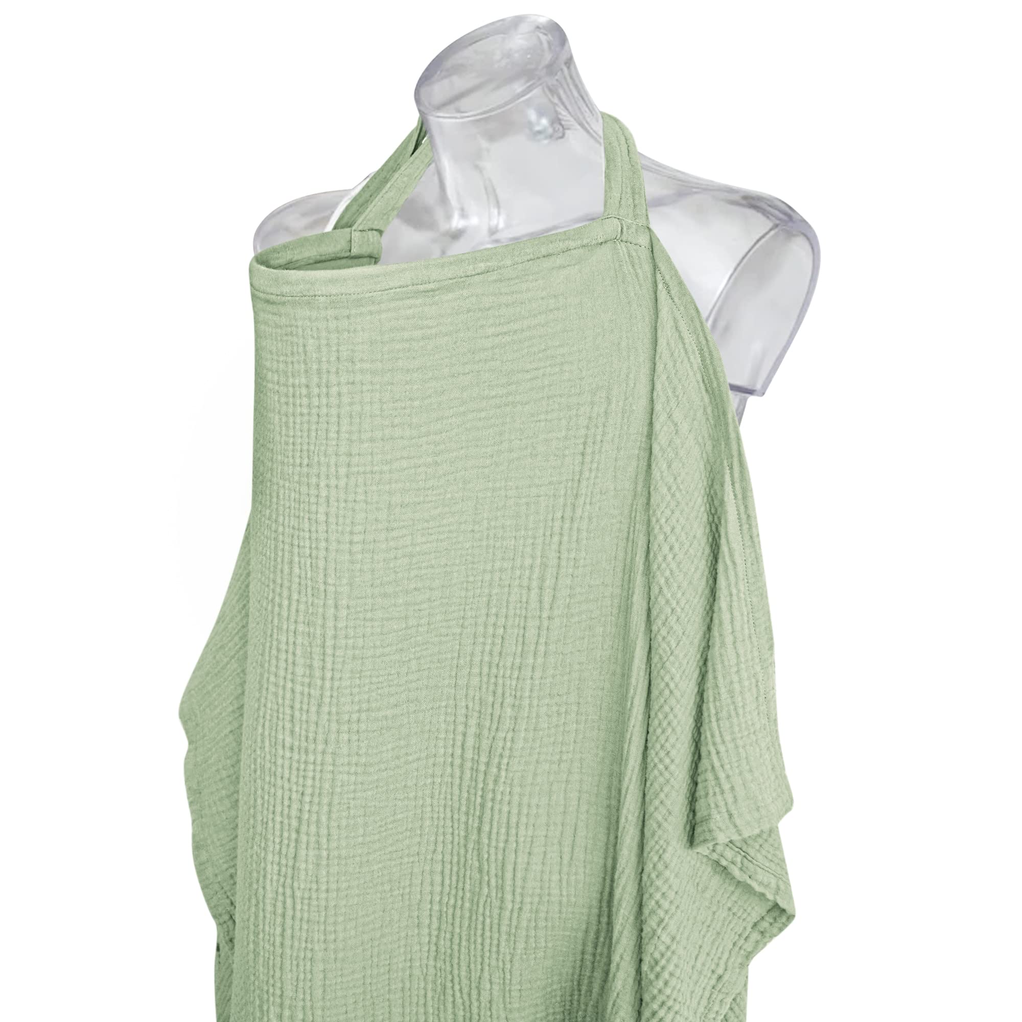 Konssy sage nursing cover used as car seat canopy for privacy.