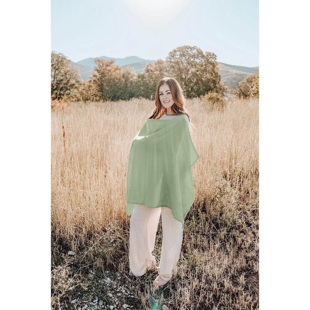 Model using Konssy sage nursing cover as stroller shield.