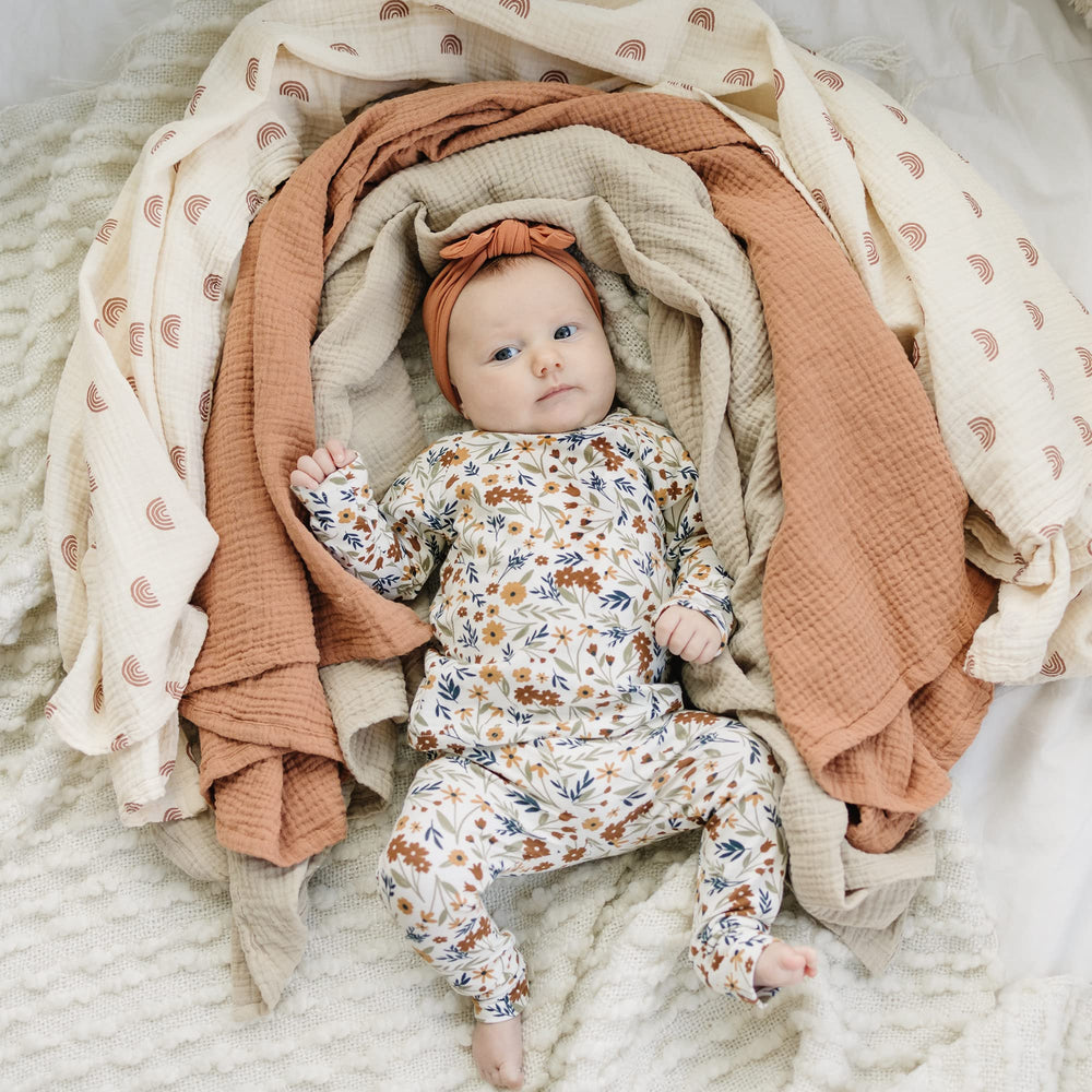 Konssy muslin swaddle blankets 3-pack 47x47 size laid flat demonstrates generous coverage for secure swaddling