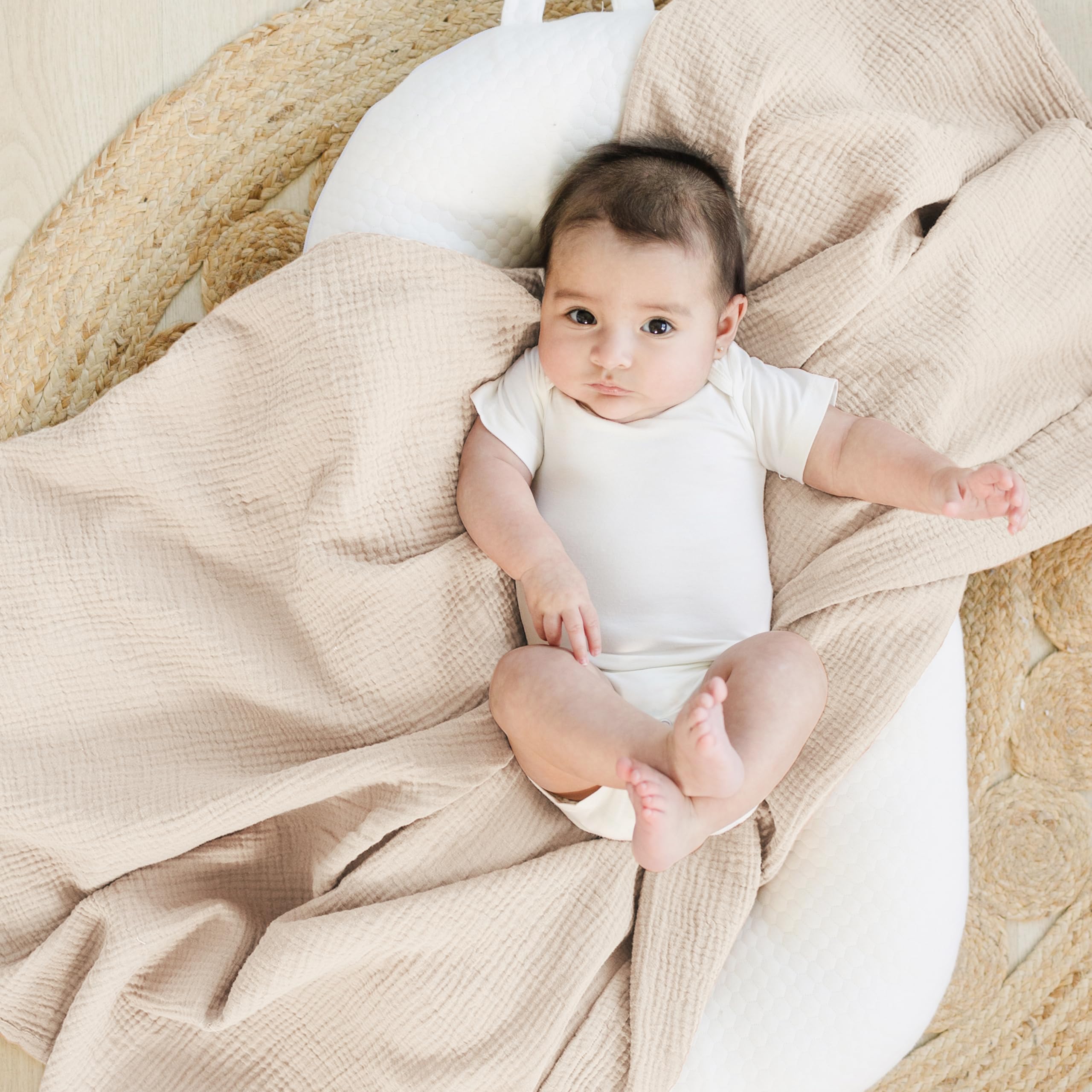 Konssy soft-touch close-up highlights breathable cotton muslin and gentle texture.