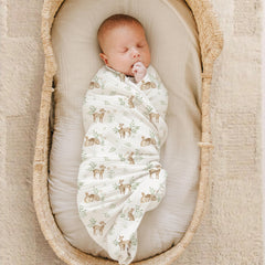 Konssy muslin swaddle blanket wrapping baby, showcasing large 47x47 inch swaddle surface.