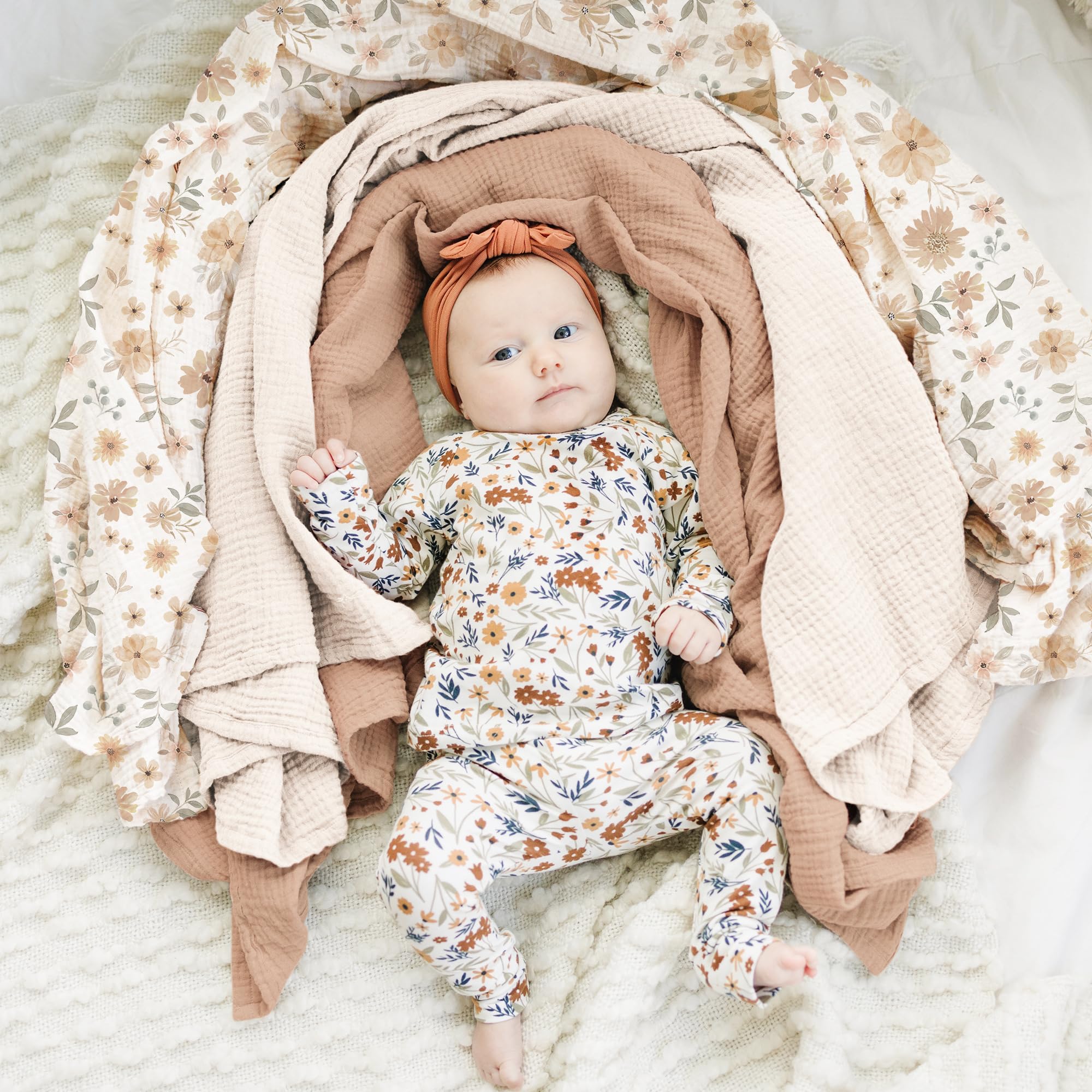Konssy muslin swaddle fabric close-up reveals breathable cotton weave and gentle touch.
