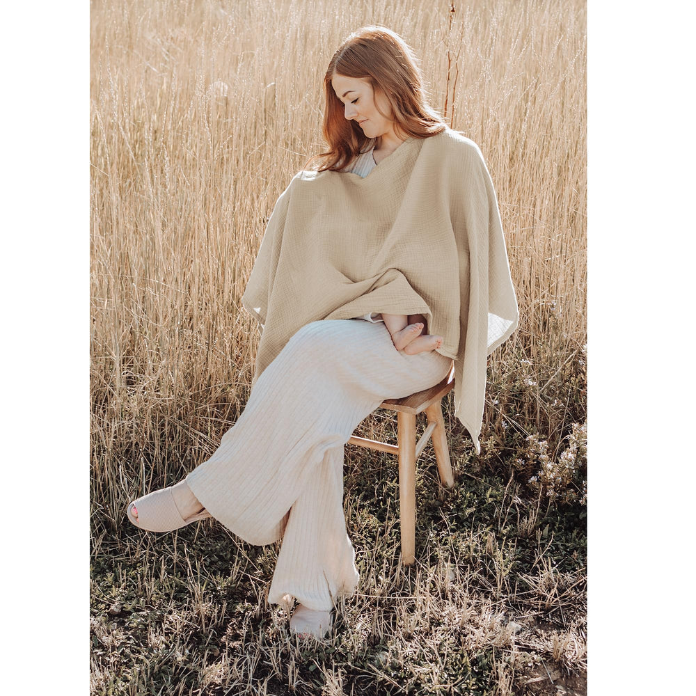 Konssy nursing cover doubles as stroller canopy for shade and privacy during feeds.
