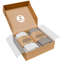 KoolerThings Pack and Play Sheets folded close-up showing ultra-soft organic cotton for baby comfort.