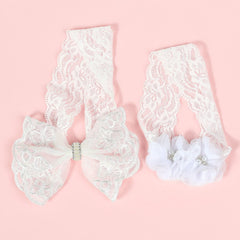 Koolgil two-pack headbands in white for birthday photos.