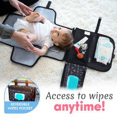 Kopi Baby diaper changer pad attached to stroller with Velcro straps for easy use.