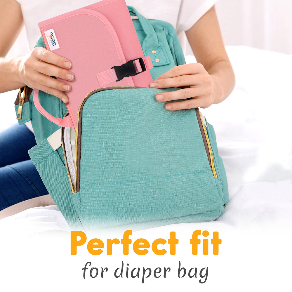 Kopi Baby foldable diaper changing pad ready for packing on trips.