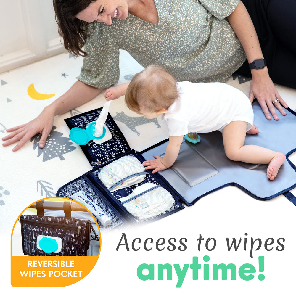 Kopi Baby portable diaper changing pad with stroller attachment offers hands-free convenience.