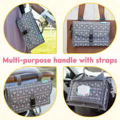 Kopi Baby changing pad attached to stroller with straps for easy on-the-go changes.