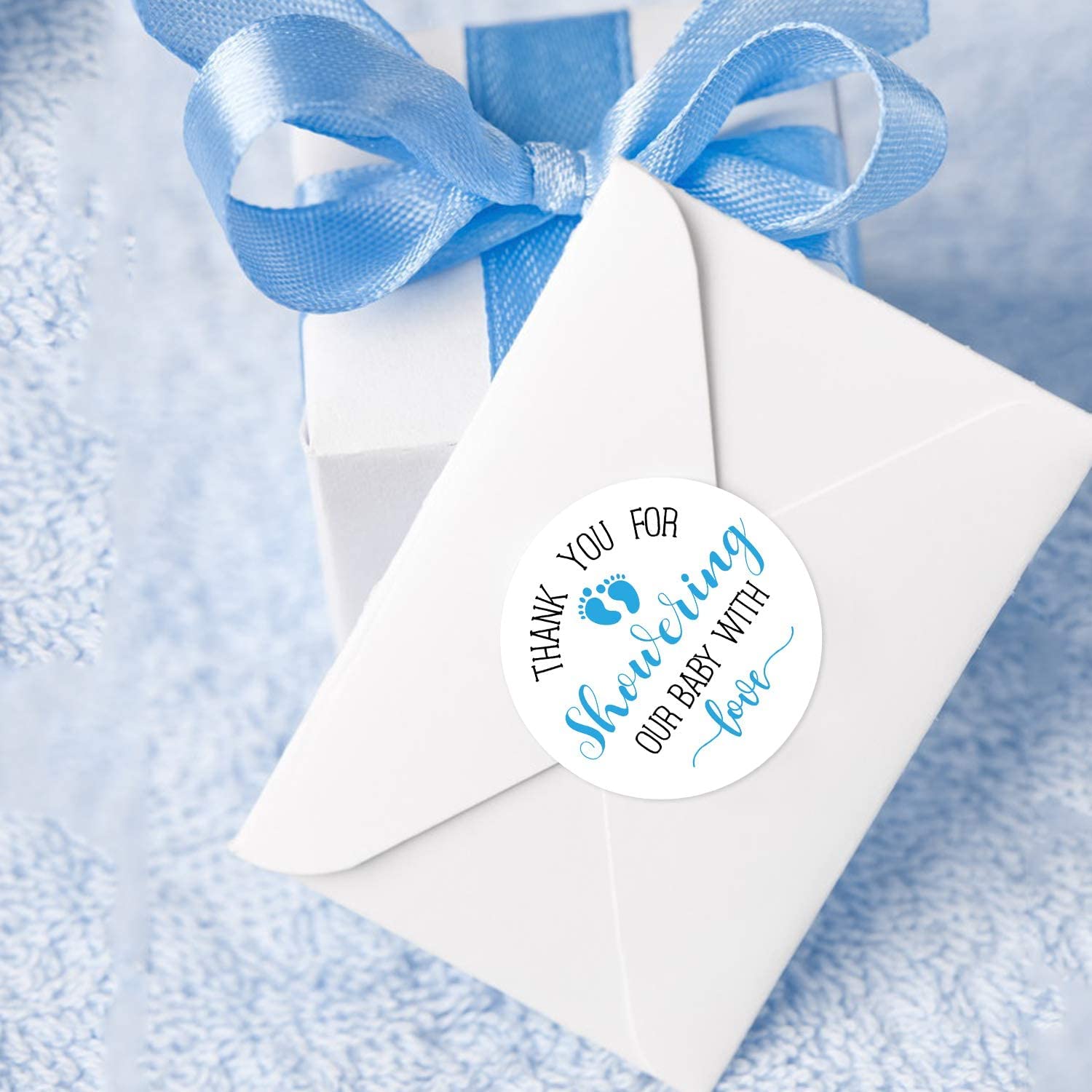 KORTTITALO envelope seals using blue feet stickers for invitations.
