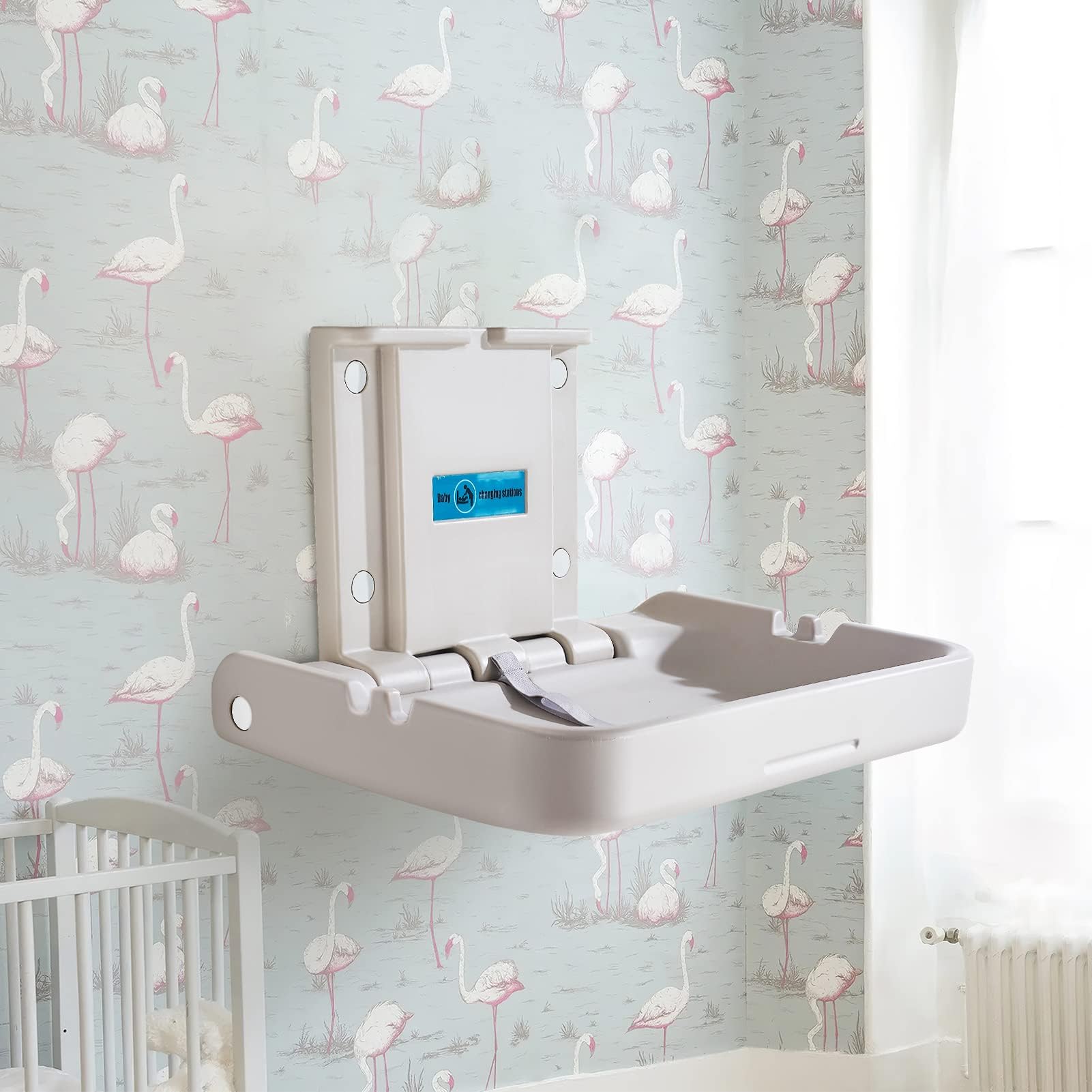 KSITEX safety straps securing baby during changes on the table.