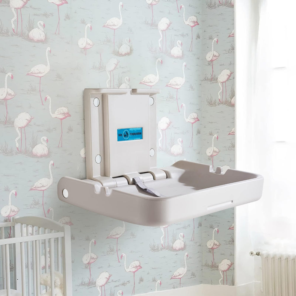 KSITEX safety straps securing baby during changes on the table.