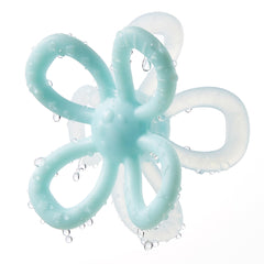 KUB Teethers blue mitten on baby hand for easy grasp and soothing gums.