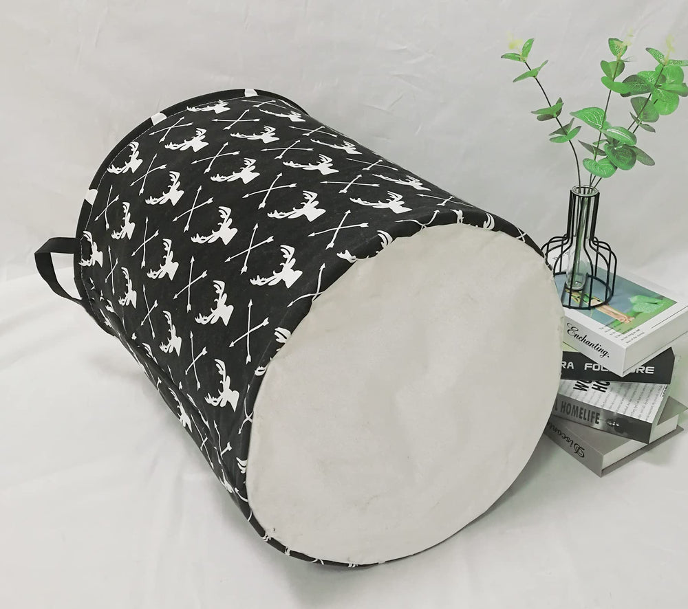 KUNRO deer-design laundry basket in nursery keeps toys organized and within reach.