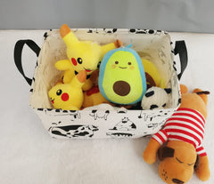 KUNRO Rectang Cow Storage Basket with handles for easy transport around the room.