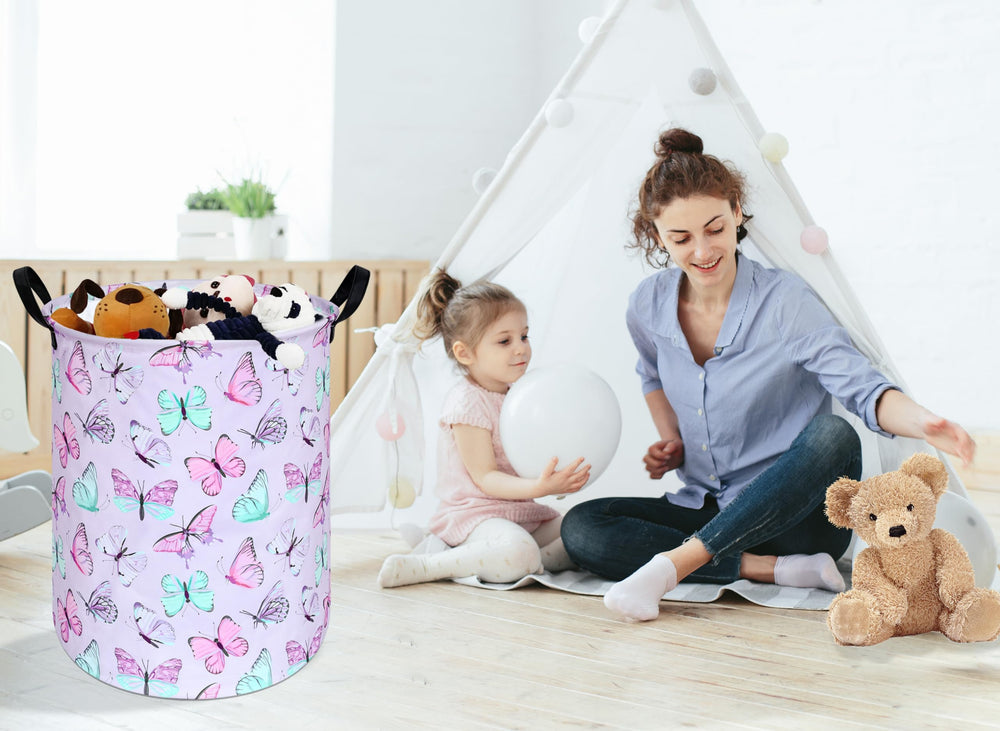 KUNRO round laundry basket used in nursery or living room to store toys and books.