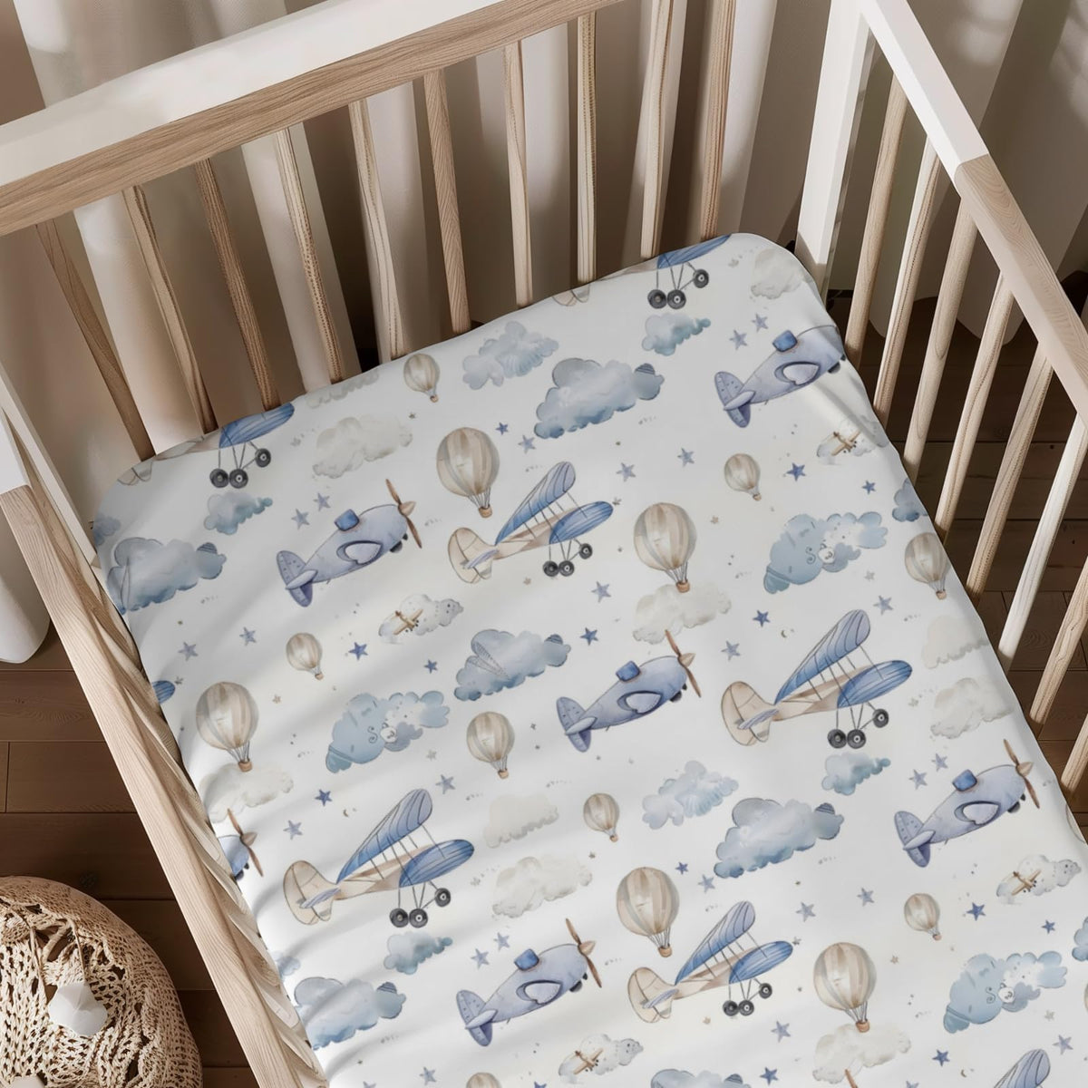 KuphiL10C plane-hot-air-balloons-crib-sheet-01 shows a cheerful aircraft design for a cozy nursery.