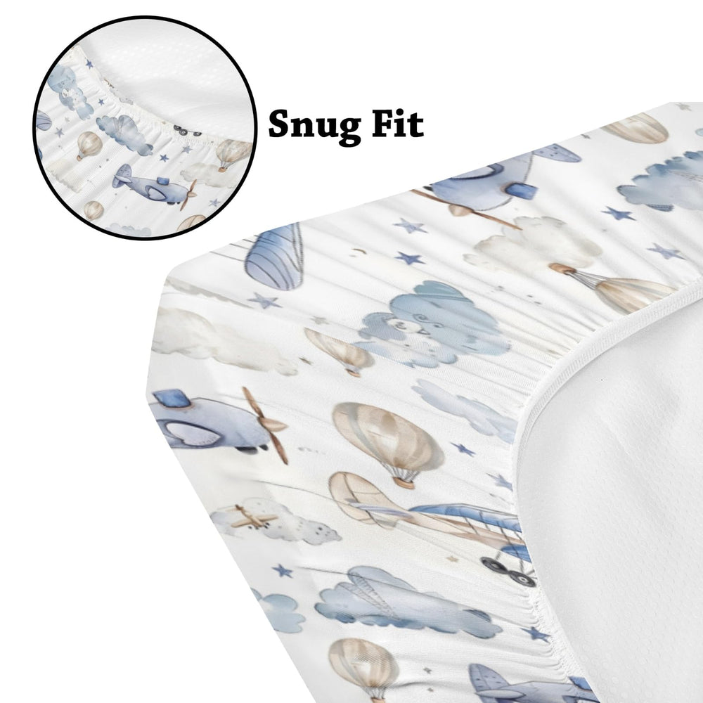 KuphiL10C plane-hot-air-balloons-crib-sheet-06 compliments nursery decor with stars and clouds.