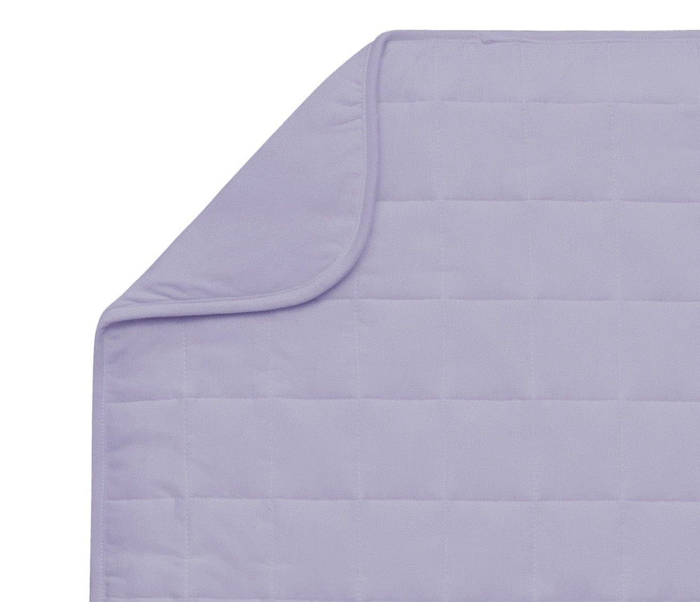 Kyte BABY blanket in Taro neatly folded offers soft warmth for naps.