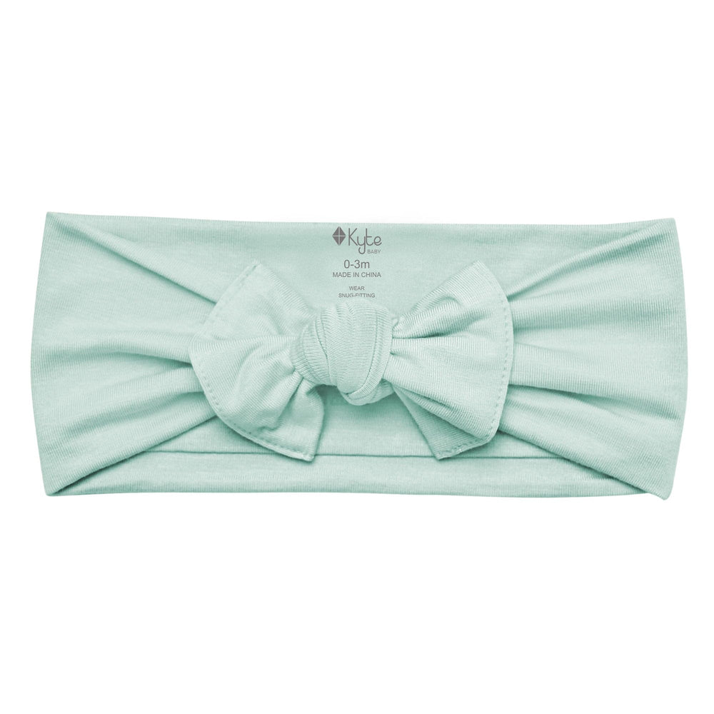 KYTE BABY bamboo bow sage back view highlights adjustable stretch for secure, gentle fit.