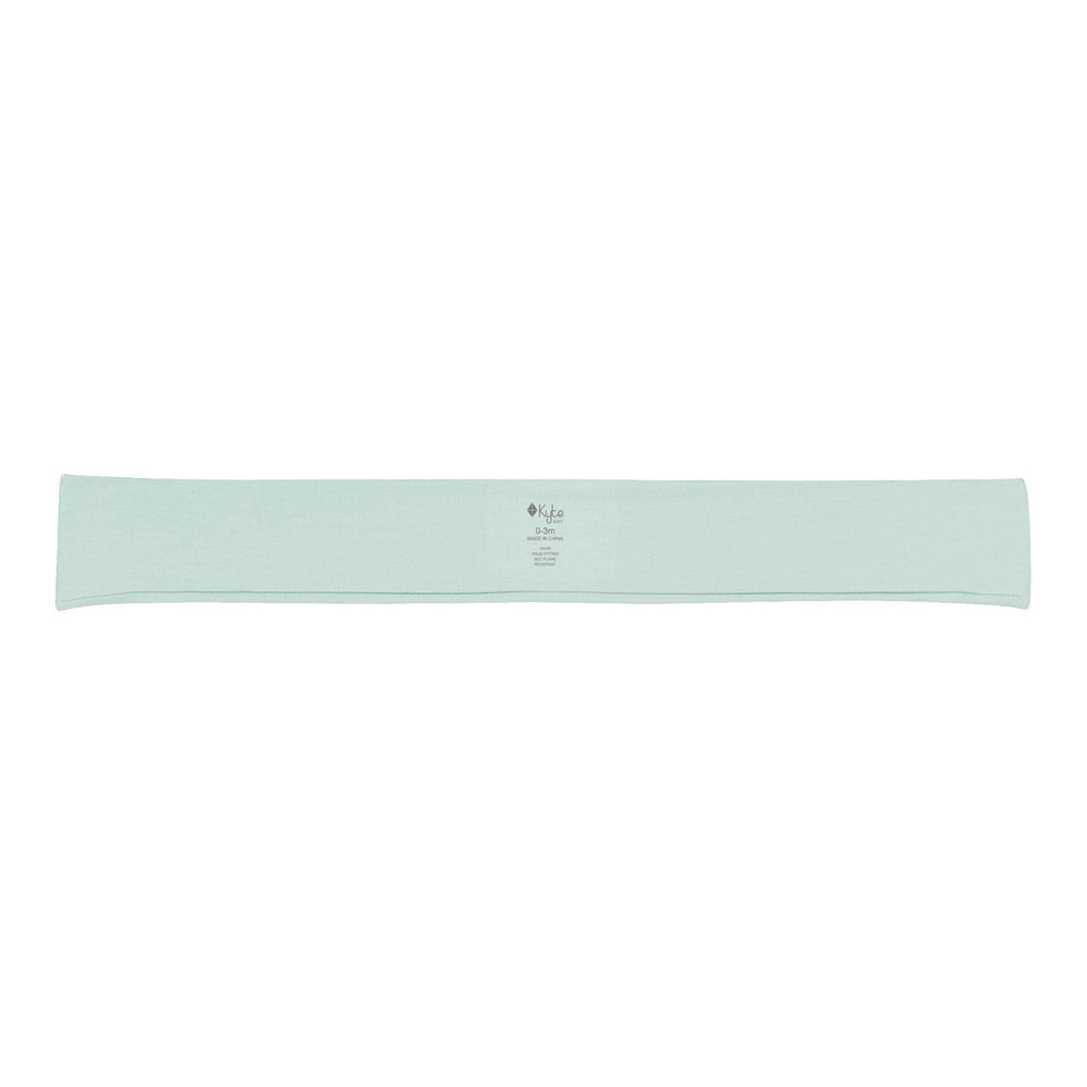 KYTE BABY bamboo bow sage closeup emphasizes soft rayon from bamboo texture for sensitive skin.