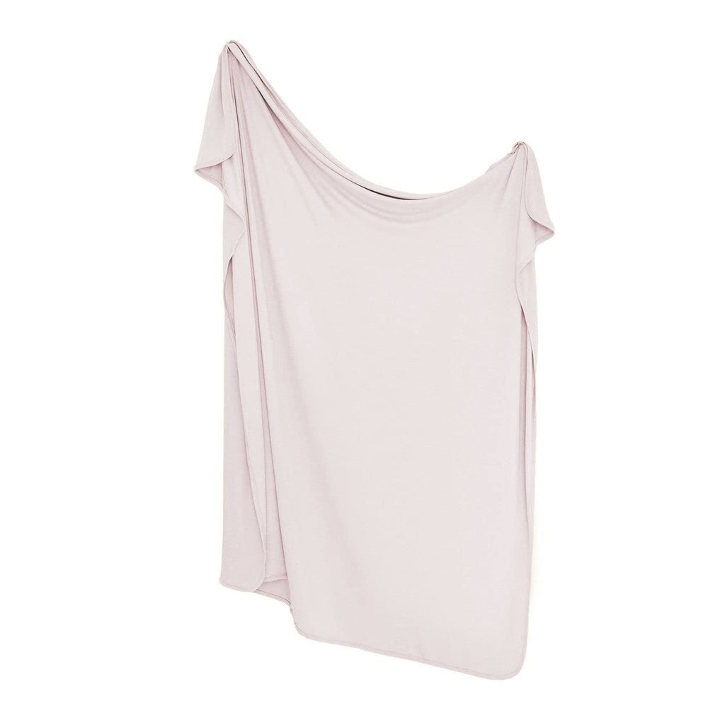 Kyte Baby bamboo swaddle in oat, soft breathable fabric folded for cozy swaddling.