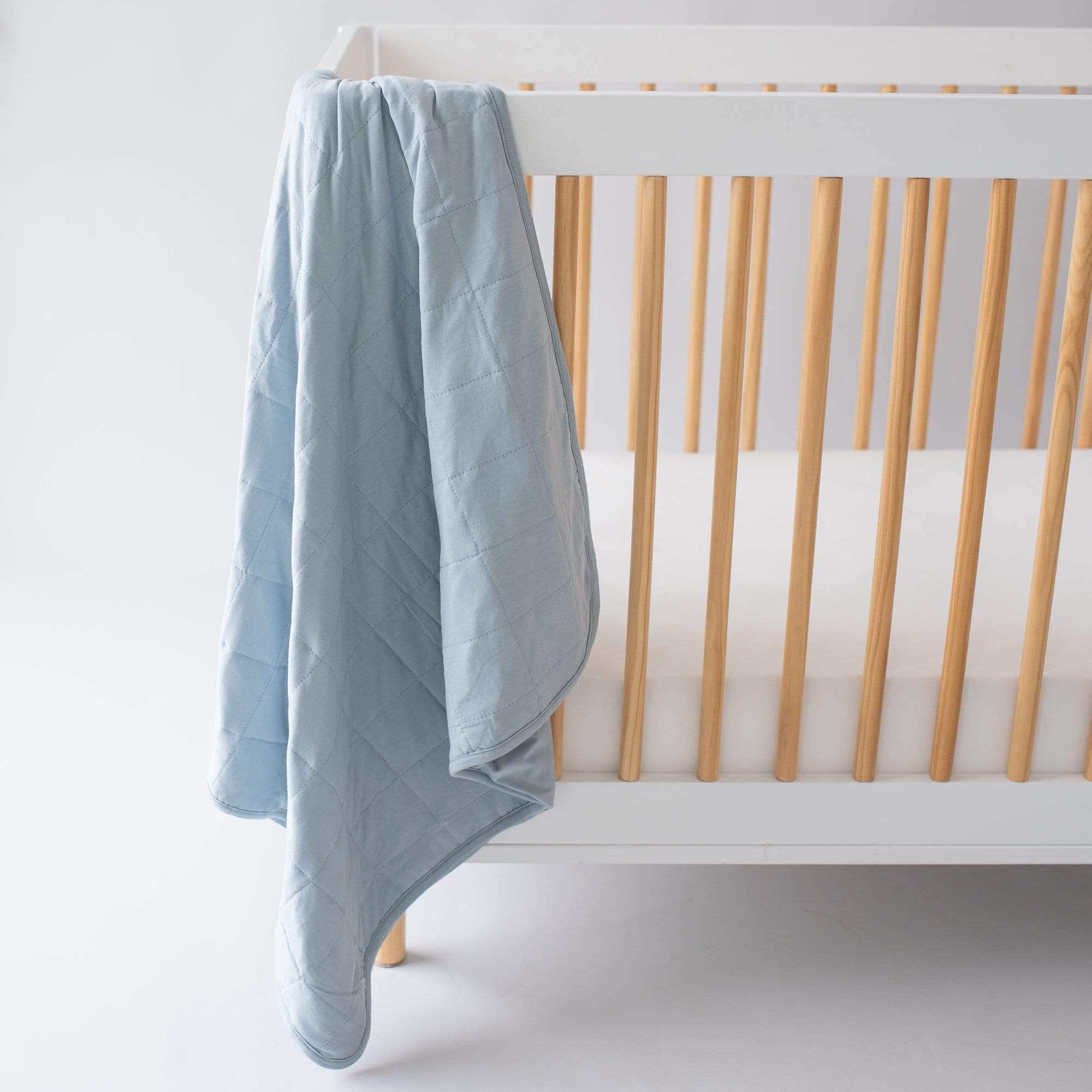 KYTE BABY Fog blanket in a nursery scene shows versatile warmth for naps.