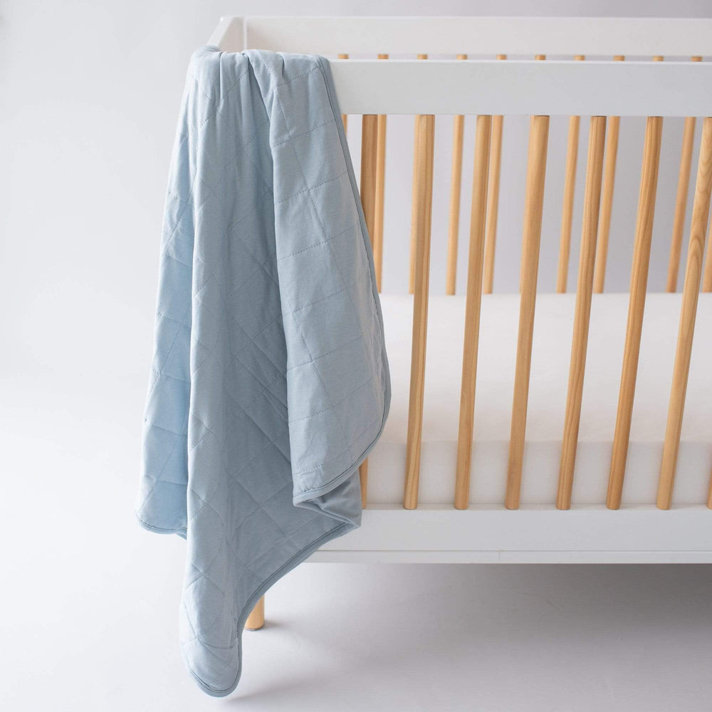KYTE BABY Fog blanket in a nursery scene shows versatile warmth for naps.