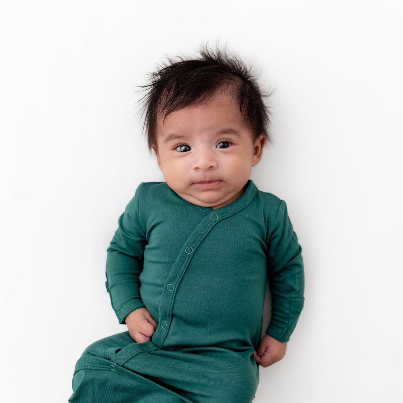 KYTE BABY Bundlers emerald fabric close-up highlights bamboo softness.