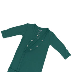 KYTE BABY Bundlers emerald sleeper laid flat for cozy comfort.