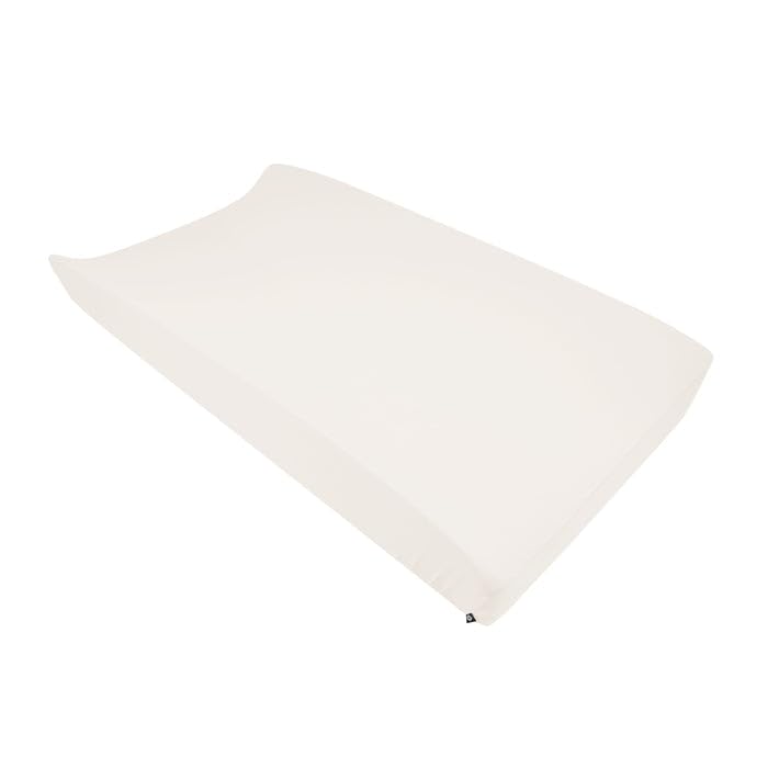 Kyte Baby change pad cover in oat bamboo rayon feels silky and stretchable for diaper changes.