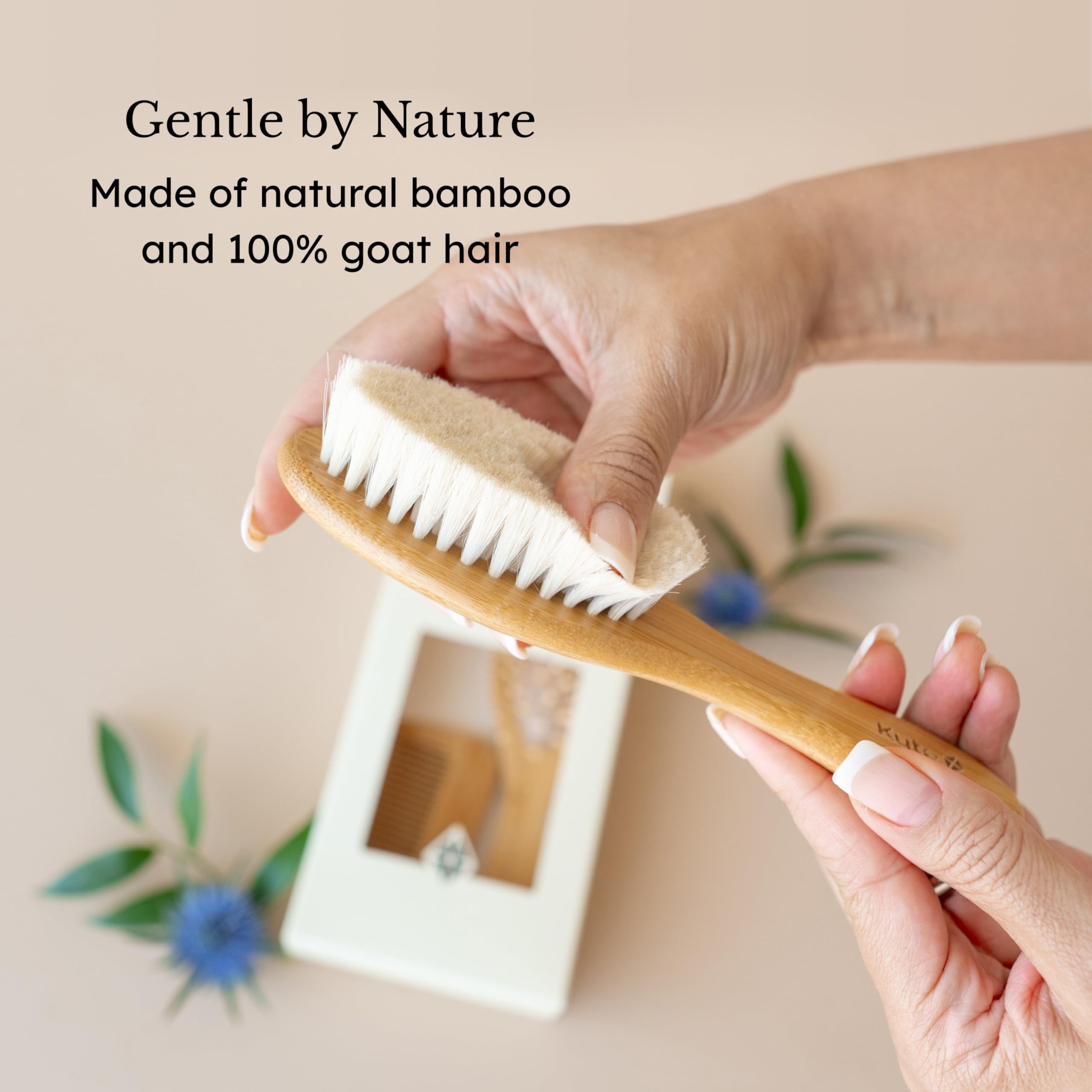 Kyte Baby cradle cap brush features a bamboo handle for eco-friendly design.