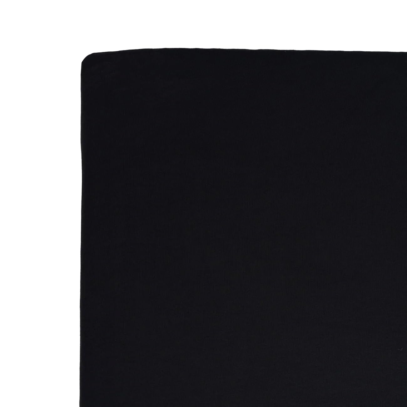 Kyte Baby crib sheet Midnight at bedside suggests easy night-time changes.