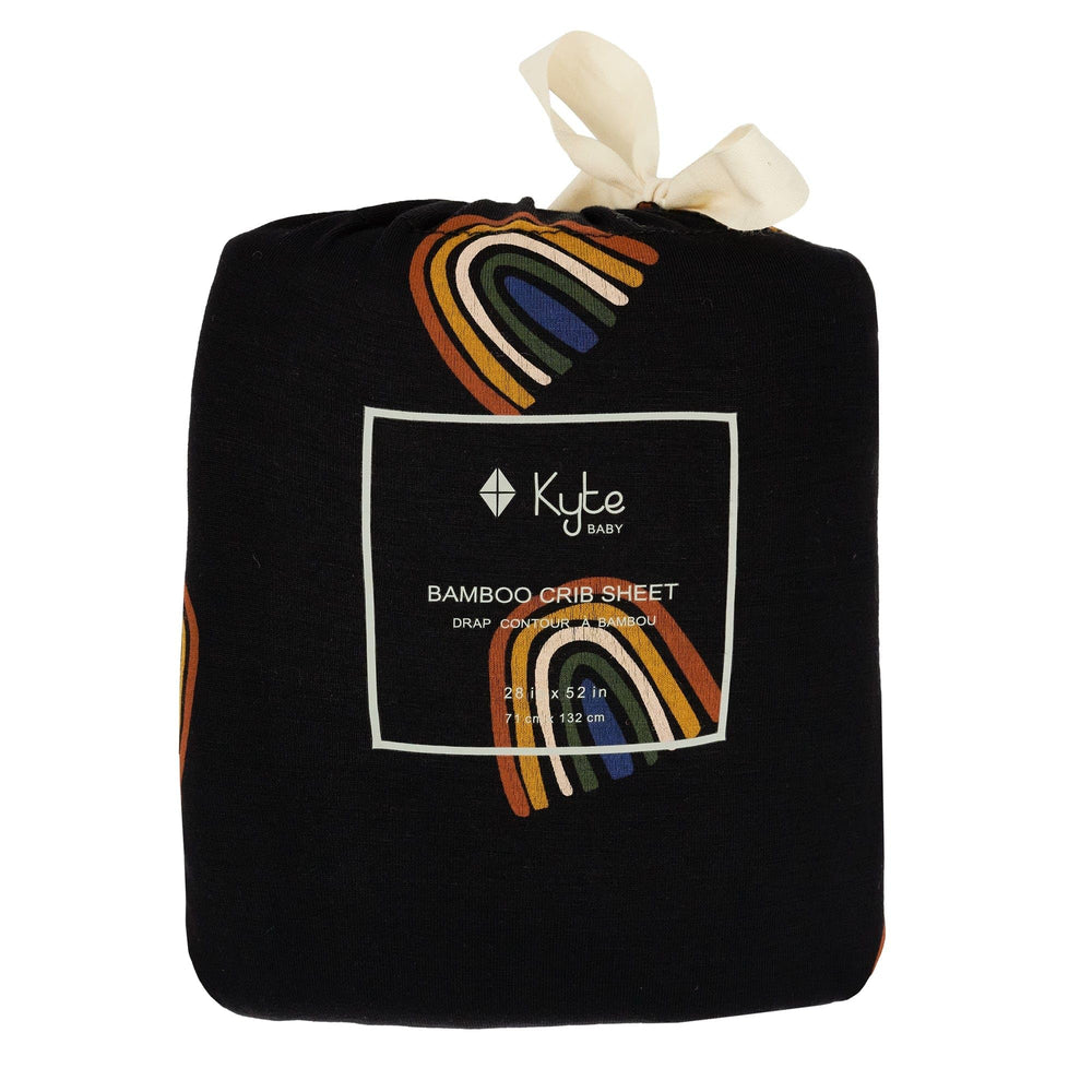 Kyte Baby crib sheet Rust Rainbow on Midnight in nursery scene adds modern style.