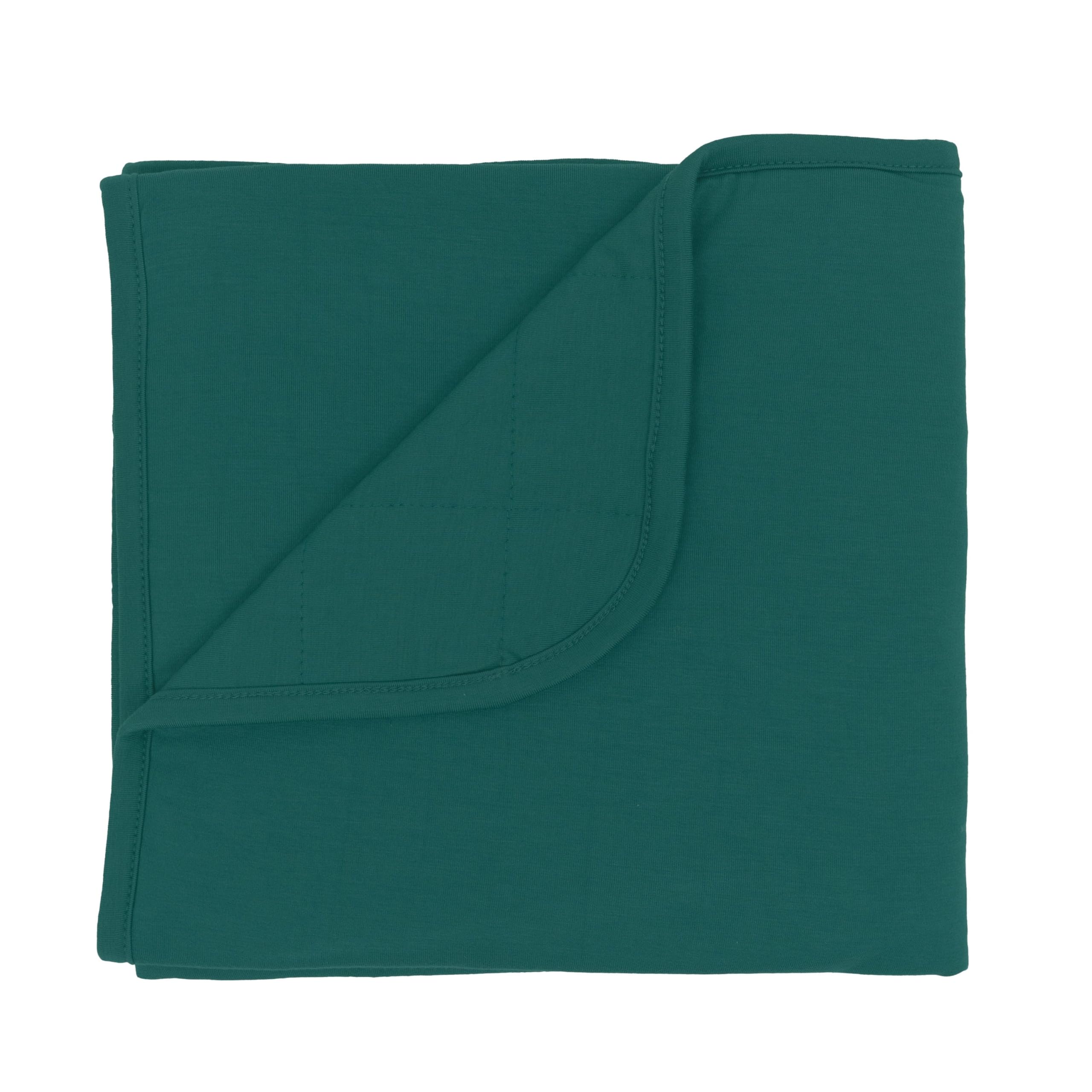 KYTE BABY Emerald baby blanket with soft bamboo rayon feel for year-round cuddling.