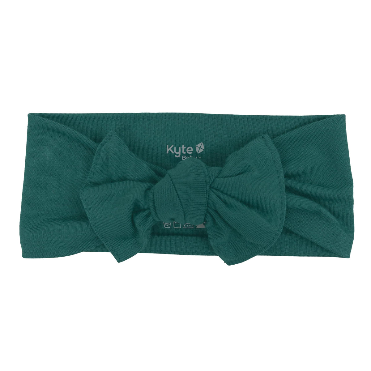KYTE BABY bamboo bow emerald closeup shows soft fabric and gentle stretch for comfortable wear.