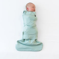Kyte Baby Sage Swaddler Sleep Bag swaddle wrap closed showing secure Velcro for snug fit