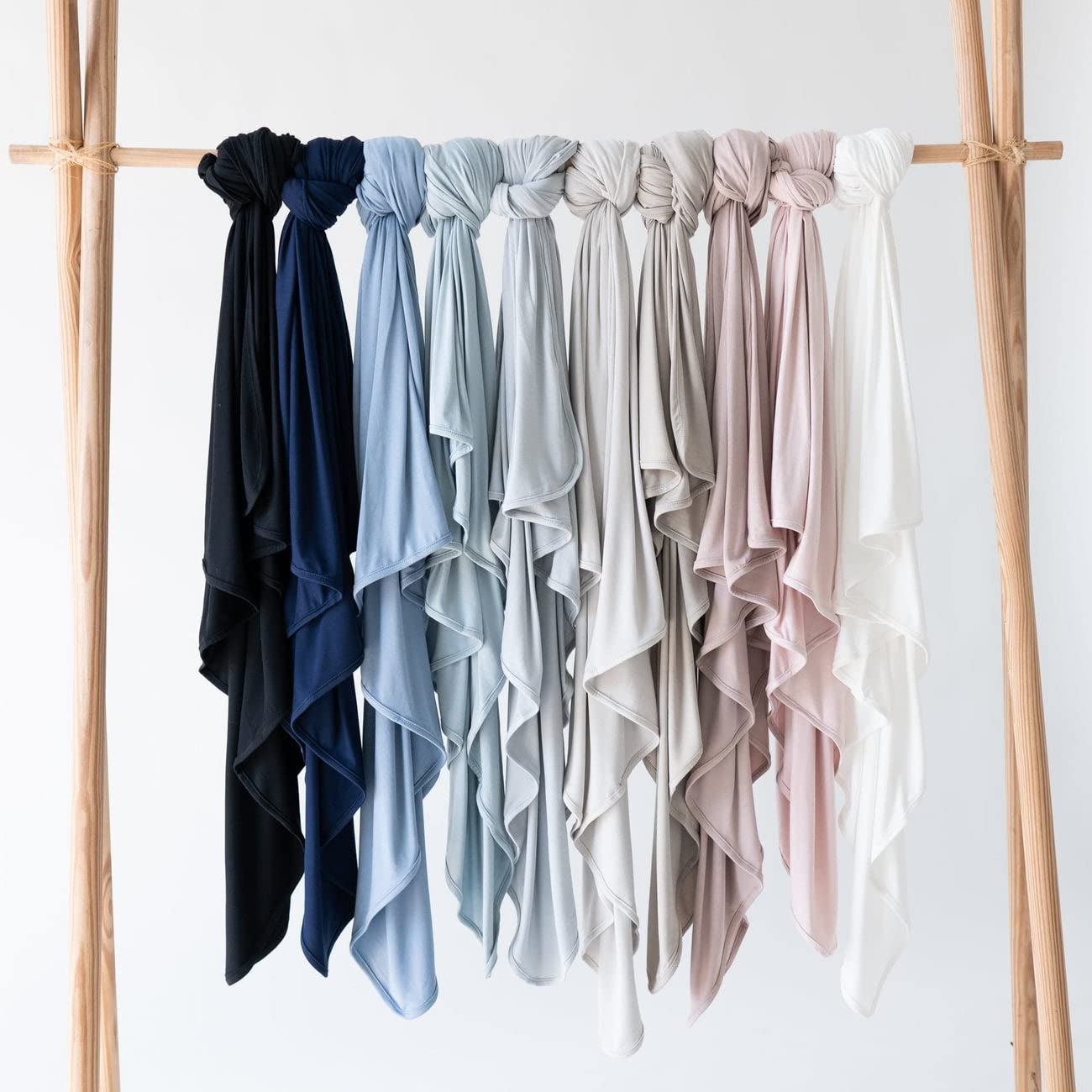 KYTE BABY slate swaddling blanket folded showcases versatile use for on-the-go sleep.